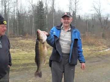 A proud fisherman displays his catch