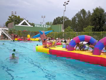 Playing on the inflatables in the swimming pool