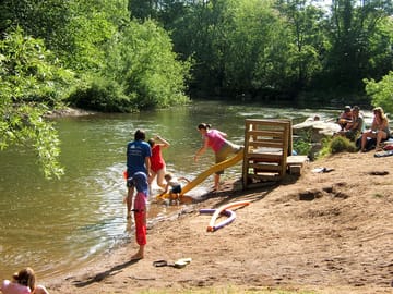 There is a small slide by the river