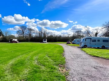 Electric hardstanding and grass touring pitch