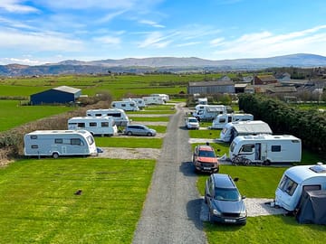 Electric hardstanding and grass pitches
