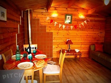 Inside wood cabin glamping style