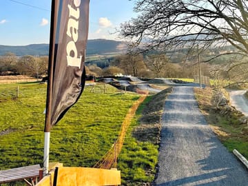 On-site bike jumps line, taken from top of roll in