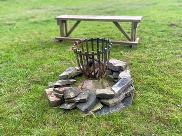 Firepit surrounded by rocks from the farm