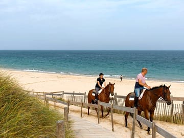 Horse riding on the beach
