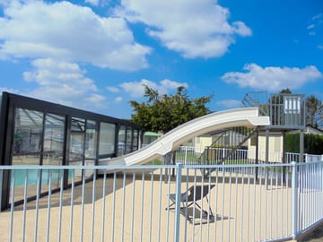 Our covered and heated swimming pool with 2 slides