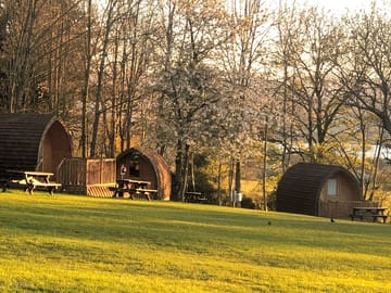 Camping pods with lake ullswater in the distance