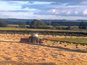 Working the farm - bailing hay on the campsite field