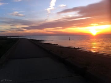 A typical turner's sunset viewed from the sea wall path just a short walk from the campsite
