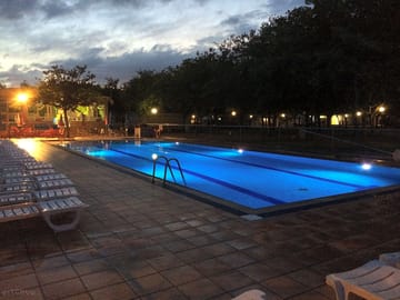 Pool by night with a view of the terrace