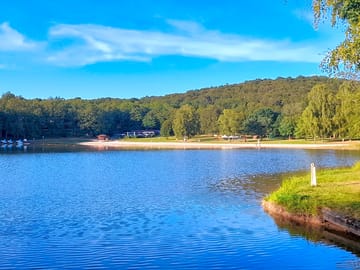 Swimming lake with beach and sunbathing area