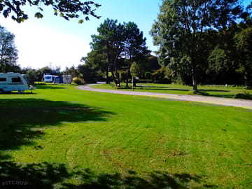 Gently sloping grass pitches