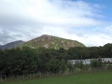 Woodland and mountains next to the site
