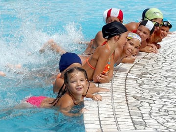 Children having fun in the pool