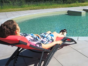 Relaxing by the swimming pool