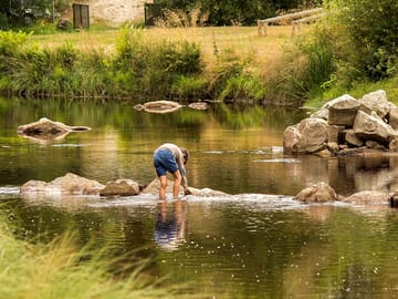By the river