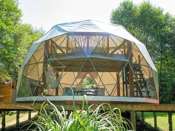 The geodesic dome on the river bank
