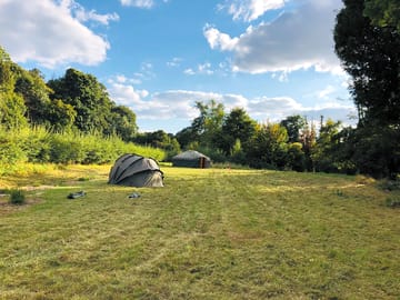 Grassy pitches by the River Ash