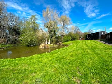 Lawn and shepherd's hut in the background