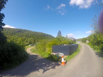 Entrance to the site, showing upper field for hook-up pitches, and lower field for tents