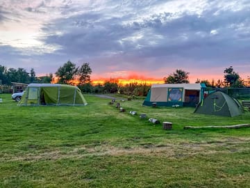 Tent pitches at sundown