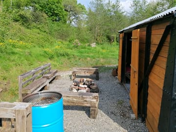Our firepit / chillout area complete with refurbished old railway carriage and stand up bbq !!!!