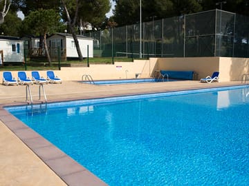 Pool with sun loungers