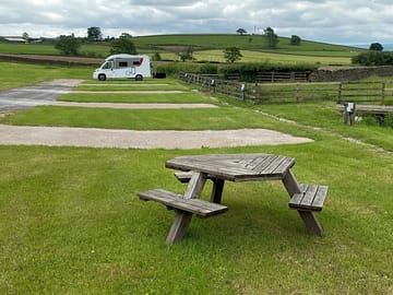 Pitches alongside a picnic bench