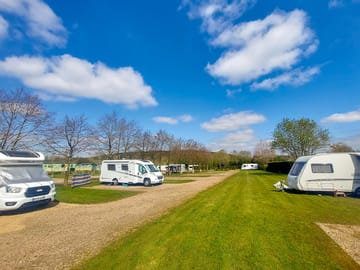 Electric Hardstanding to the left and Electric grass pitches to the right