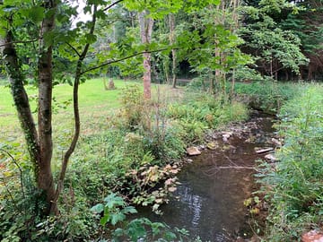 Lleiniog river alongside the amenities field