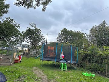 Play area and trampoline