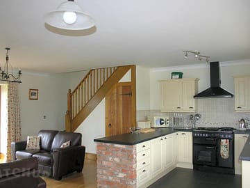 Open plan kitchen and living area in holiday cottages