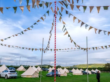 Festival-inspired site with bunting and strings of lights