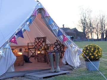 The tents have solar fairy lights, along with candle lanterns inside