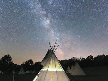 The tipis at night