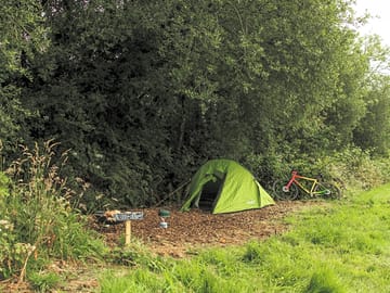 Sheltered tent pitch
