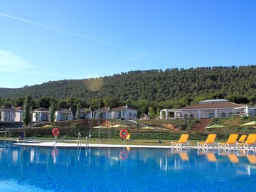 The swimming pool and solarium with comfy sun loungers