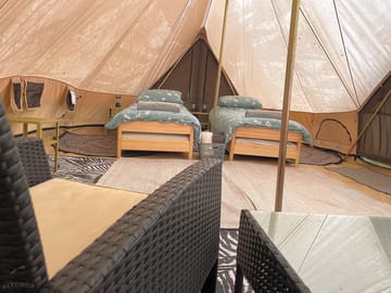 Bell tent set up with two single beds