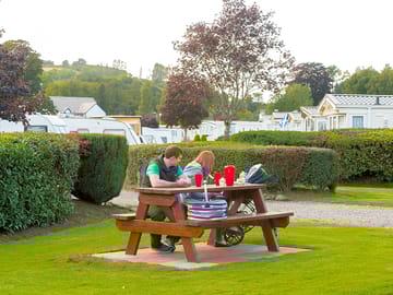 Couple sitting at a bench on the park