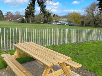 Picnic bench under the trees