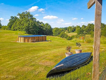 The site is surrounded by greenery