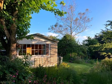 Rose chalet in early may