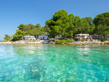 View of the pitches from the crystal clear water