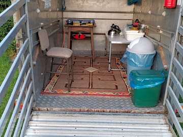 Basic kitchen with gas hob, pots and pans