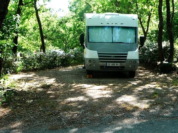 Campervan on a shaded pitch