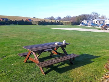 There are a number of picnic tables round the site