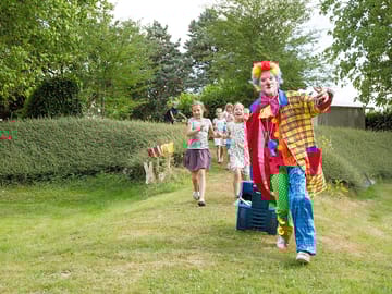 Clown leading the fun in high season