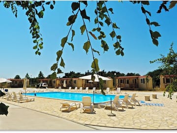 Pool with sun loungers