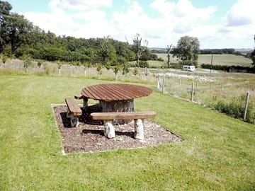 Table and benches within the grounds at greetham retreat