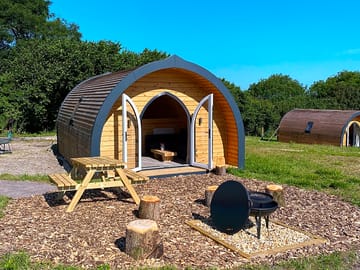 Outside space with picnic table and firepit